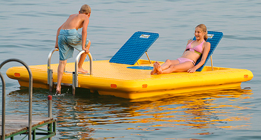 2017 a couple in their yellow swim raft at lake in Skaneateles, New York